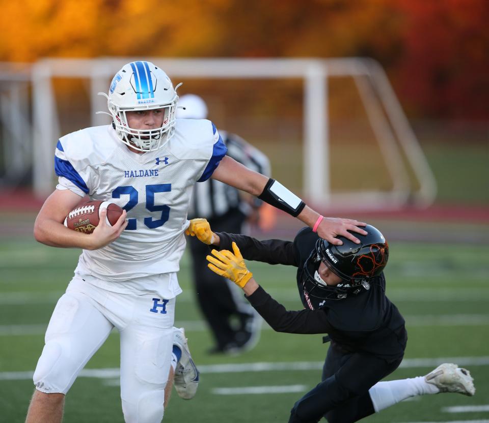 Tuckahoe's Jake Matarazzo tries to grab onto Haldane's Evan Giachinta during the Section 1 Class D football championship on November 12, 2021.