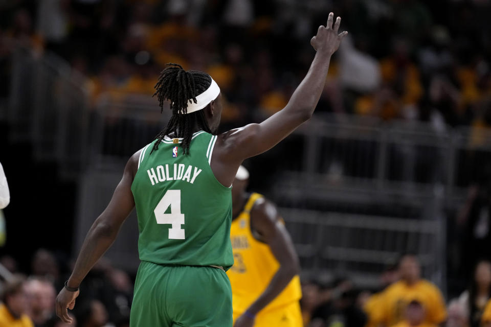 Boston Celtics guard Jrue Holiday celebrates after making a three-point basket during the second half of Game 4 of the NBA Eastern Conference basketball finals against the Indiana Pacers, Monday, May 27, 2024, in Indianapolis. The Celtics won 105-102.(AP Photo/Michael Conroy)