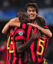 Manchester City's Italian forward Mario Balotelli () celebrates with teammate Argentinian defender Pablo Zabaleta and French defender Gaël Clichy (C) after scoring during the Champions League group A football match SSC Napoli vs Manchester City on November 22, 2011 at the San Paolo stadium in Naples . AFP PHOTO / ALBERTO PIZZOLI (Photo credit should read ALBERTO PIZZOLI/AFP/Getty Images)