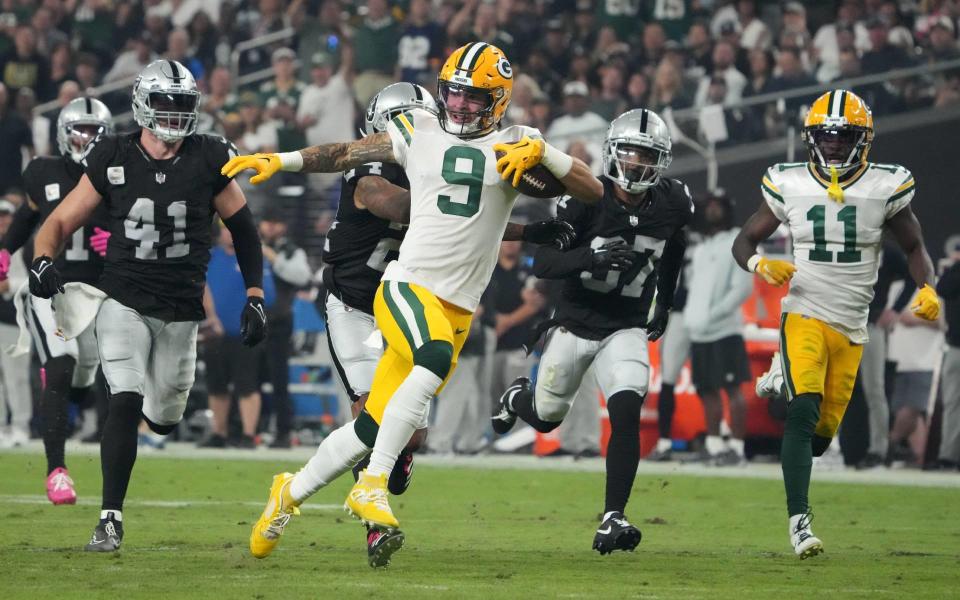 Oct 9, 2023; Paradise, Nevada, USA; Green Bay Packers wide receiver Christian Watson (9) is pursued by <a class="link " href="https://sports.yahoo.com/nfl/teams/las-vegas/" data-i13n="sec:content-canvas;subsec:anchor_text;elm:context_link" data-ylk="slk:Las Vegas Raiders;sec:content-canvas;subsec:anchor_text;elm:context_link;itc:0">Las Vegas Raiders</a> linebacker <a class="link " href="https://sports.yahoo.com/nfl/players/31708" data-i13n="sec:content-canvas;subsec:anchor_text;elm:context_link" data-ylk="slk:Robert Spillane;sec:content-canvas;subsec:anchor_text;elm:context_link;itc:0">Robert Spillane</a> (41), cornerback <a class="link " href="https://sports.yahoo.com/nfl/players/28406" data-i13n="sec:content-canvas;subsec:anchor_text;elm:context_link" data-ylk="slk:Marcus Peters;sec:content-canvas;subsec:anchor_text;elm:context_link;itc:0">Marcus Peters</a> (24) and cornerback Tyler Hall (37) on a 77-yard reception in the second half at Allegiant Stadium. Mandatory Credit: Kirby Lee-USA TODAY Sports