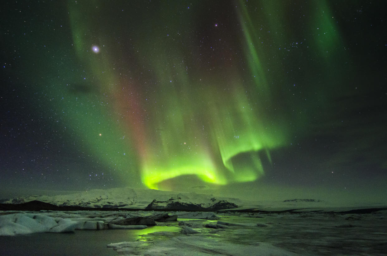 Aurora Borealis or Northern lights over Jokulsarlon (glacial lagoon), Iceland.