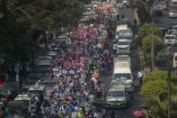 Anti-coup protesters march in Yangon, Myanmar, Thursday, Feb. 25, 2021. Social media giant Facebook announced Thursday it was banning all accounts linked to Myanmar's military as well as ads from military-controlled companies in the wake of the army's seizure of power on Feb. 1. (AP Photo)