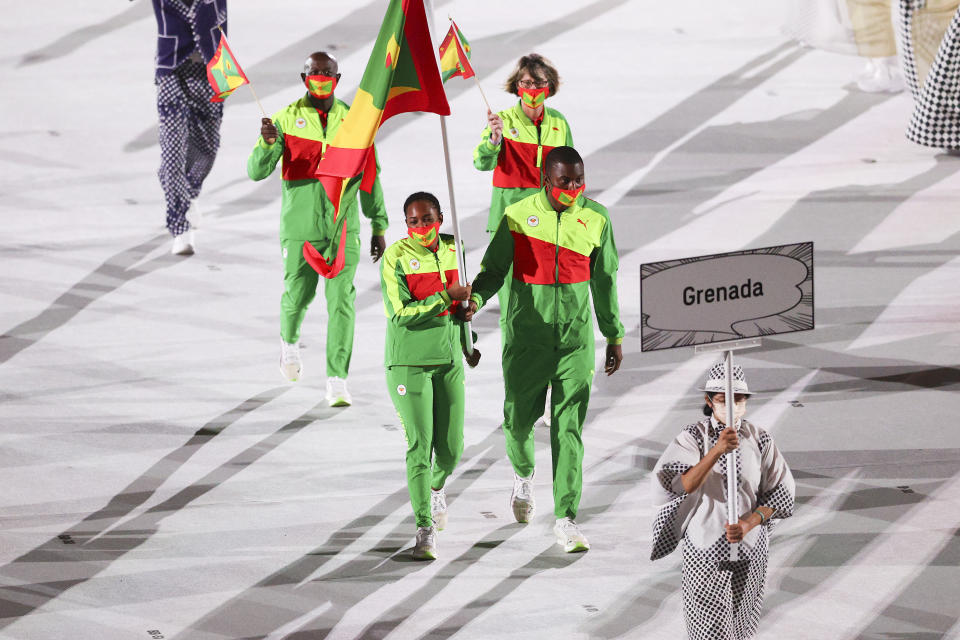 <p>TOKYO, JAPAN - JULY 23: Flag bearers Kimberly Ince and Delron Felix of Team Grenada during the Opening Ceremony of the Tokyo 2020 Olympic Games at Olympic Stadium on July 23, 2021 in Tokyo, Japan. (Photo by Patrick Smith/Getty Images)</p> 