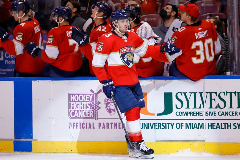 Jan 15, 2022; Sunrise, Florida, USA; Florida Panthers center Carter Verhaeghe (23) celebrates with teammates after scoring a goal during the first period against the Columbus Blue Jackets at FLA Live Arena. Mandatory Credit: Sam Navarro-USA TODAY Sports