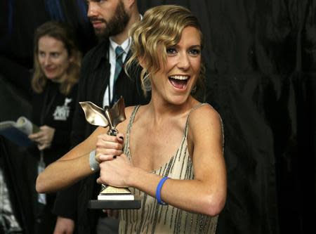 Producer Caitrin Rogers of "20 Feet From Stardom" holds the Best Documentary award backstage at the 2014 Film Independent Spirit Awards in Santa Monica, California March 1, 2014. REUTERS/Danny Moloshok