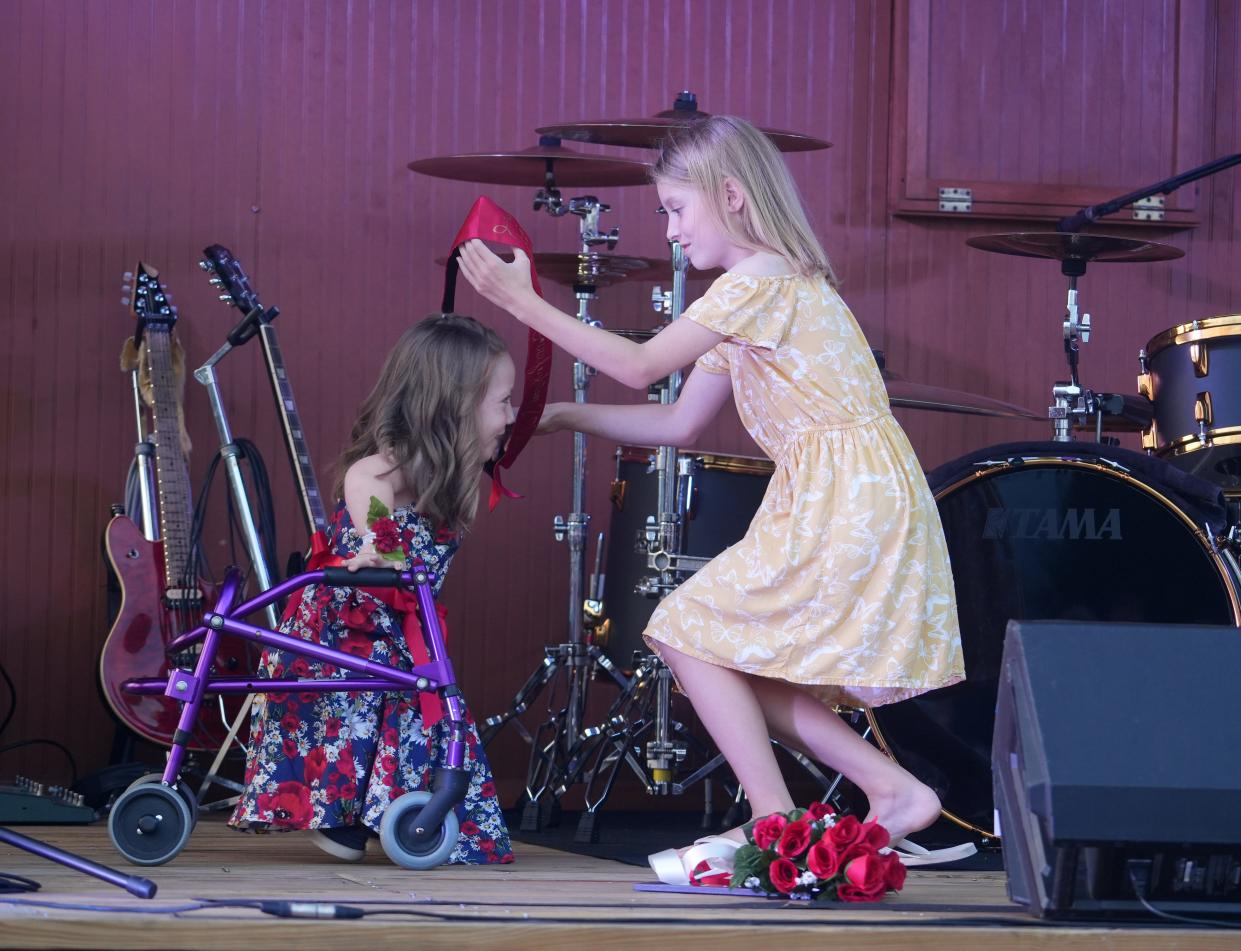 Ellynor Messer, left, is crowned as the 2023 Little Miss Firefighter by 2022 queen Emmalyn Pagnanelli on Aug. 16, 2023.