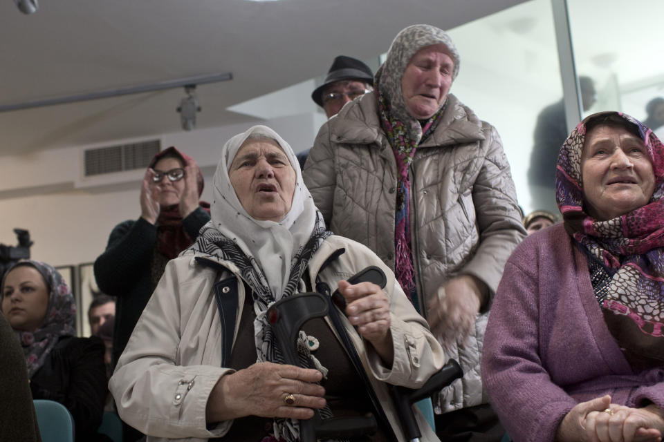Relatives of victims of the Srebrenica genocide weep as they hear news on the decision of the UN appeals judges on former Bosnian Serb leader Radovan Karadzic in Potocari, Bosnia and Herzegovina, Wednesday, March 20, 2019. United Nations appeals judges on Wednesday upheld the convictions of Karadzic for genocide, war crimes and crimes against humanity, and increased his sentence from 40 years to life imprisonment. (AP Photo/Marko Drobnjakovic)