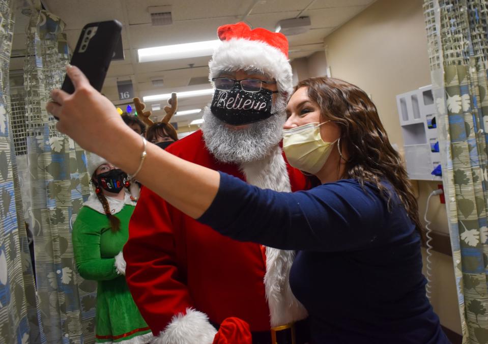 Santa takes a selfie with a nurse at Wilson Hospital on Christmas Eve.