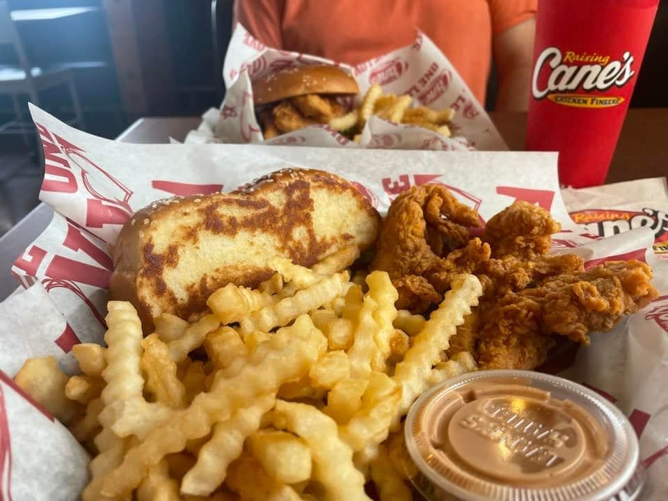 Plate of chicken fingers, Texas toast, and crinkle-cut fries at Raising Cane's