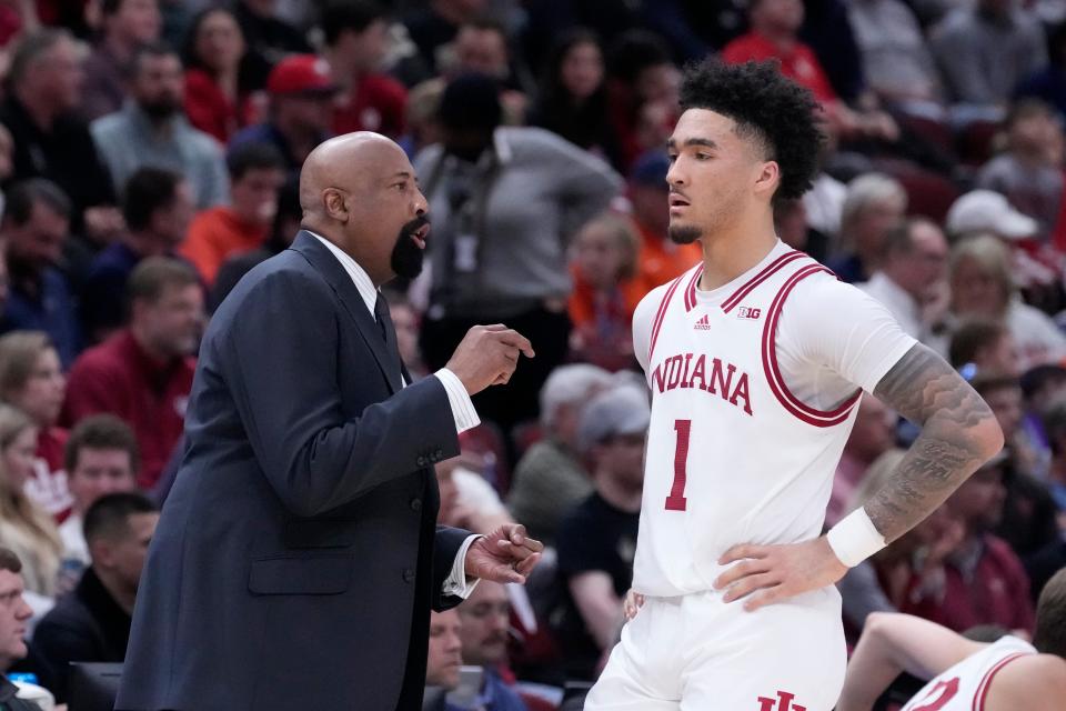 Indiana head coach Mike Woodson talks with Jalen Hood-Schifino during the first half of a Big Ten Tournament game against Maryland, Friday, March 10, 2023, in Chicago.