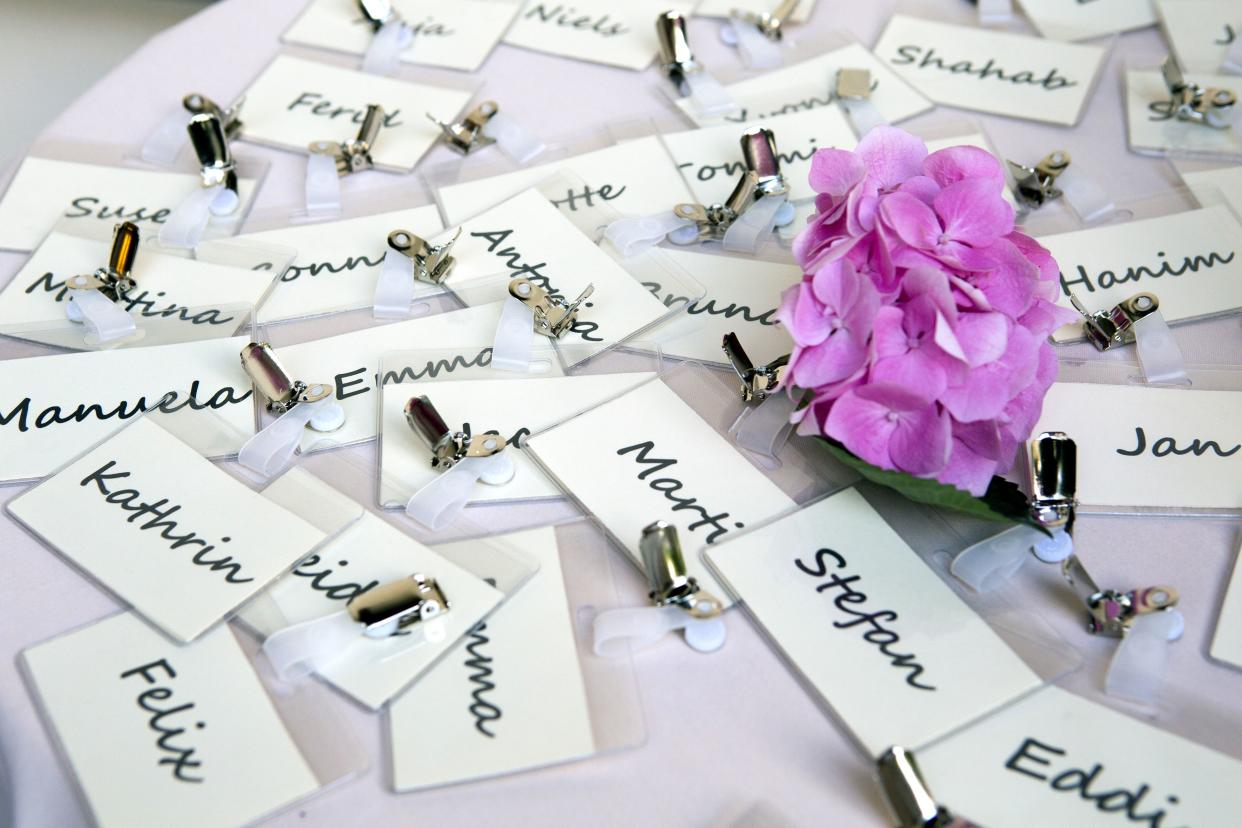 bunch of nametags scattered on a table