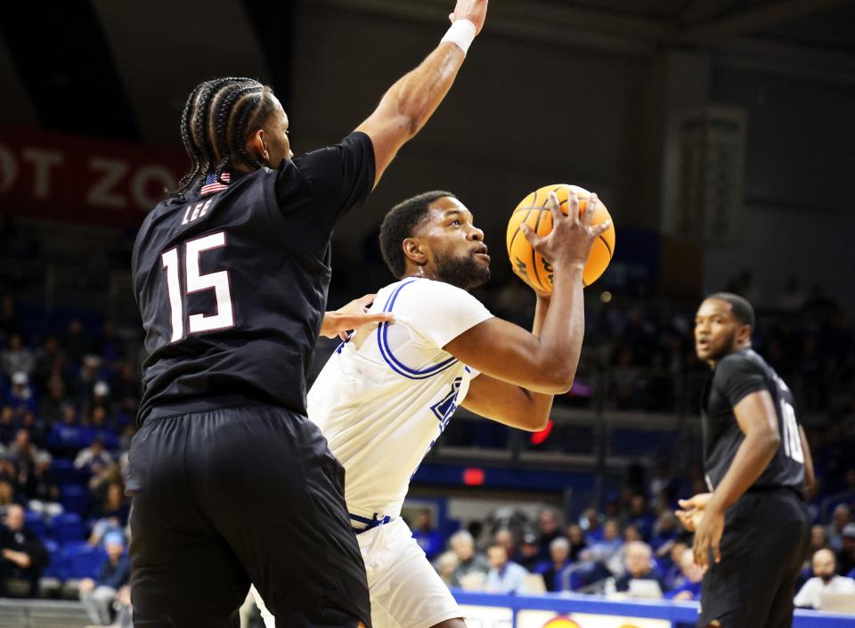 Drake guard Kyron Gibson (0) shoots for two as the Missouri State Bears play the Drake Bulldogs at the Knapp Center in Missouri Valley Conference action in Des Moines on Saturday, December 2, 2023.