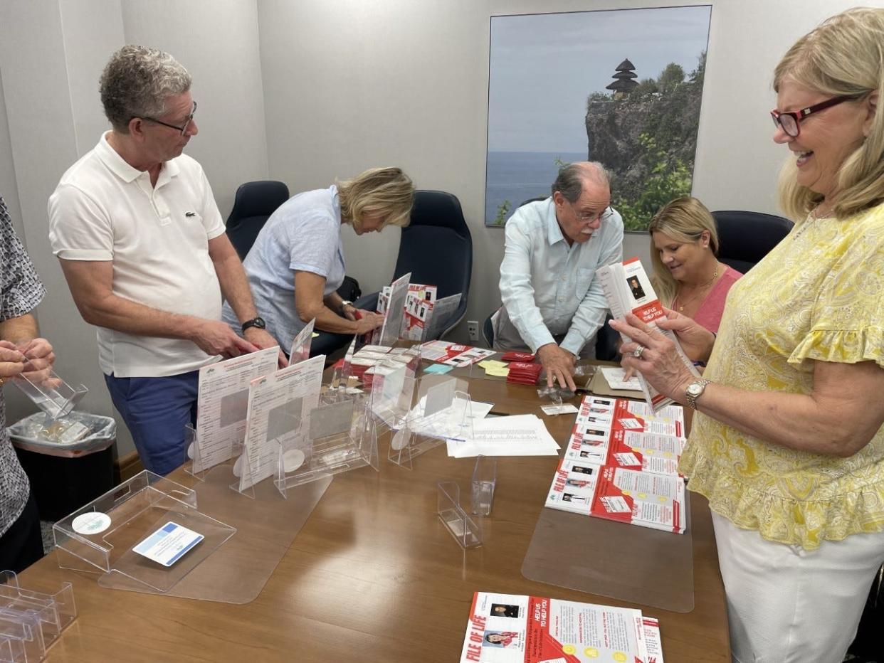 Members of the Citizens' Association of Palm Beach prepare to distribute File of Life information to condominiums, government buildings and businesses on the island. The File for Life initiative provides medical information to first responders when patients are unable to do so.