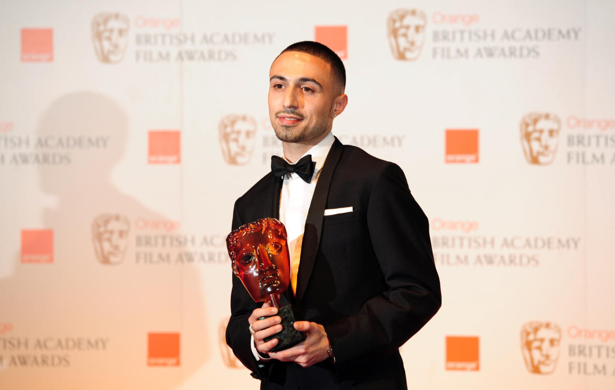 British actor Adam Deacon poses with the Rising Star Award at the BAFTA British Academy Film Awards at the Royal Opera House in London on February 12, 2012.  AFP PHOTO / LEON NEAL (Photo credit should read LEON NEAL/AFP via Getty Images)