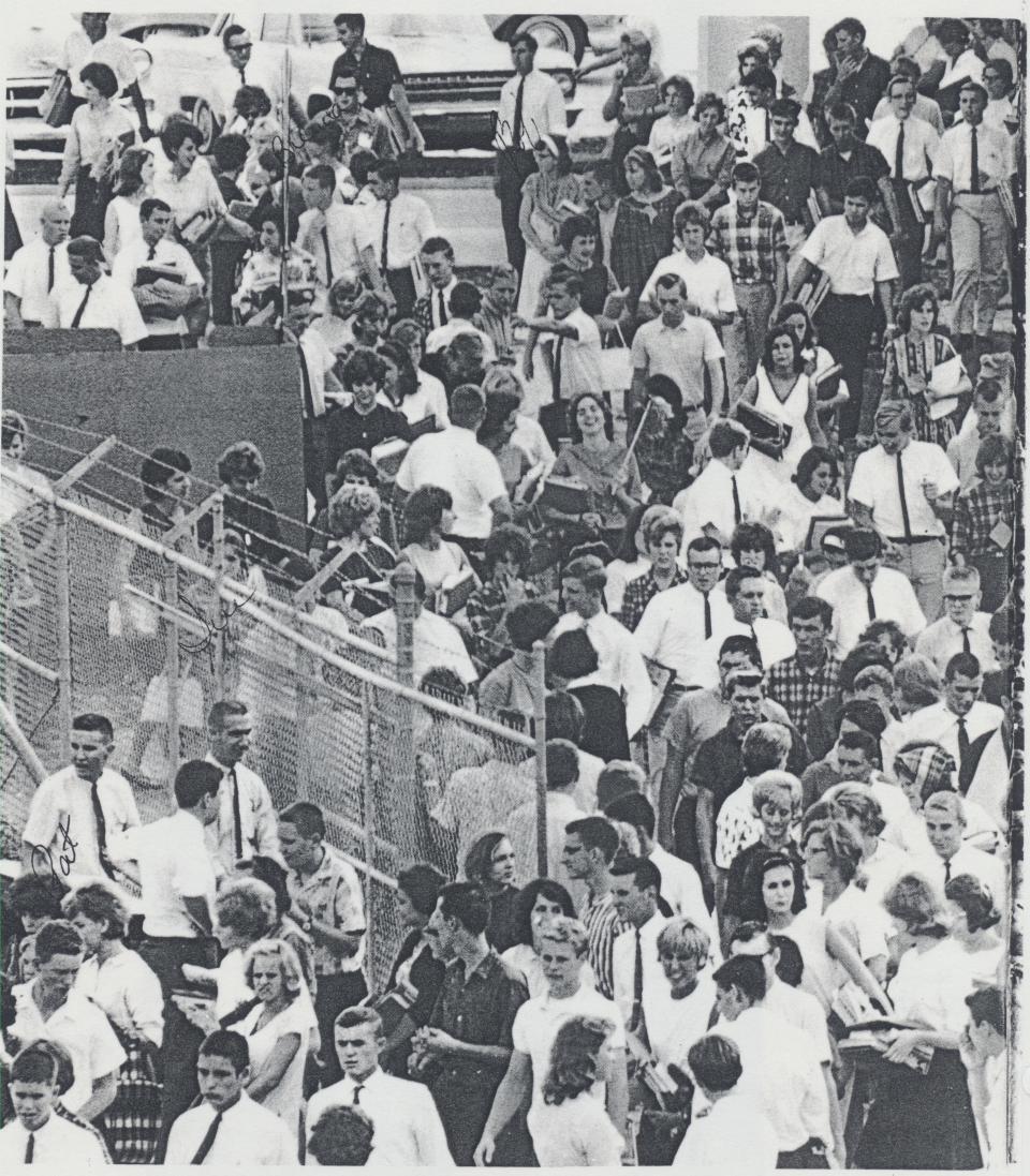 Between classes, circa 1964, students travel from the Paul Rudolph addition to the 1927 Sarasota High School building.