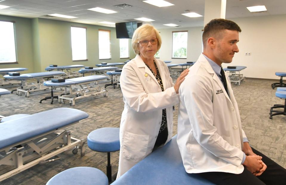 Dr. Doris Newman demonstrates osteopathic medicine with Thomas Baez, a Rockledge medical student, inside a newly remodeled Burrell College of Osteopathic Medicine laboratory inside the L3 Harris Commons Building at the Florida Institute of Technology.