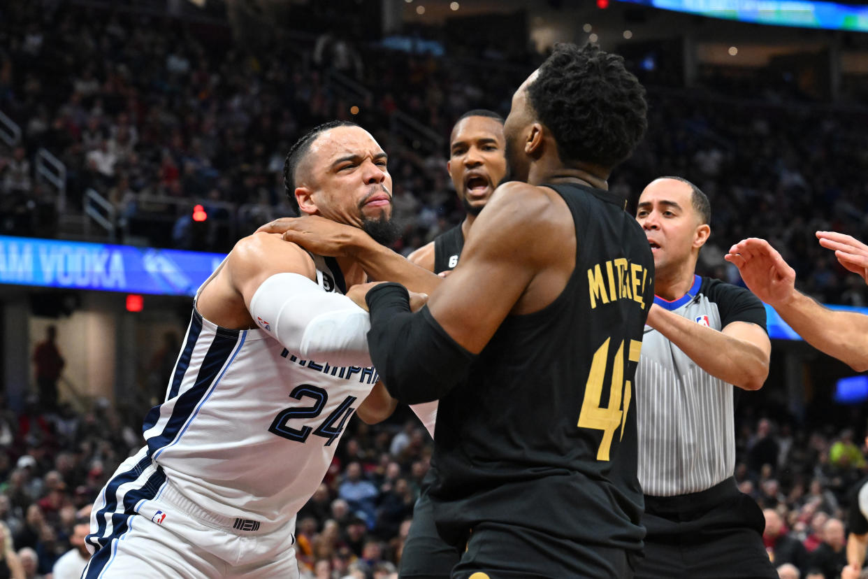 Dillon Brooks of the Memphis Grizzlies fights with Donovan Mitchell of the Cleveland Cavaliers