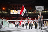 <p>TOKYO, JAPAN - JULY 23: Flag bearers Hend Zaza and Ahmad Saber Hamcho of Team Syria during the Opening Ceremony of the Tokyo 2020 Olympic Games at Olympic Stadium on July 23, 2021 in Tokyo, Japan. (Photo by Matthias Hangst/Getty Images)</p> 