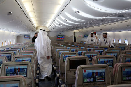 Visitors tour an Airbus A380 of Emirates during the Dubai Airshow in Dubai, United Arab Emirates November 13, 2017. REUTERS/Satish Kumar