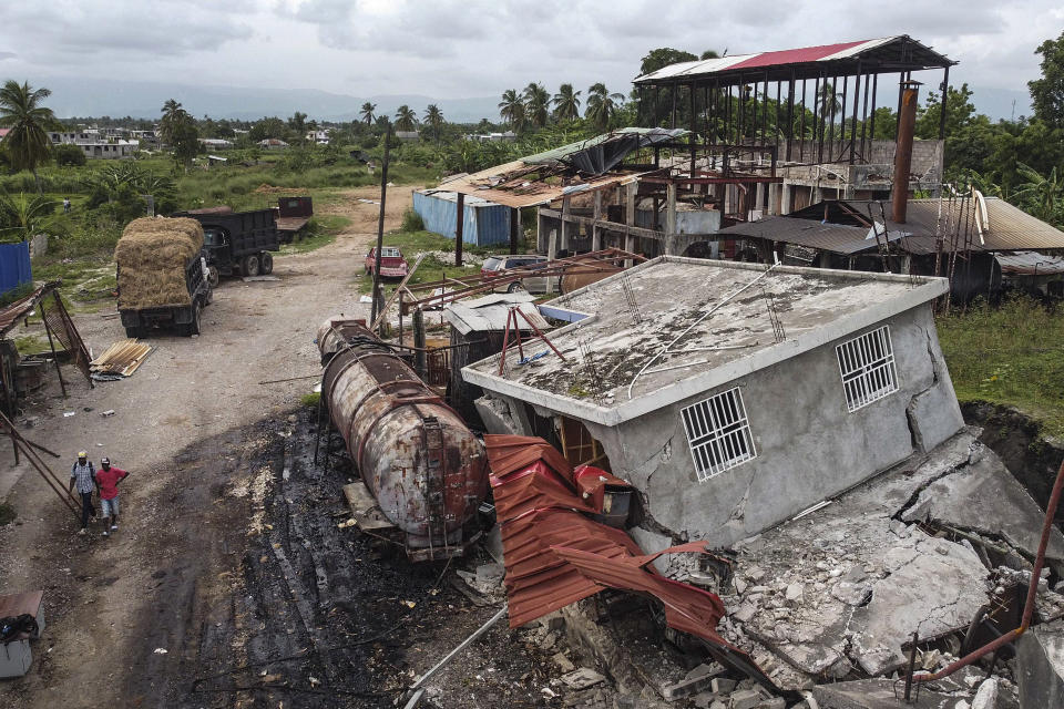 Machinery sits at the Etheuss vetiver oil factory after it was made inoperable by the 7.2 magnitude earthquake in Les Cayes, Haiti, Thursday, Aug. 19, 2021. Many of the factories that contributed to the multimillion-dollar industry responsible for more than half the world's vetiver oil used in fine perfumes, cosmetics, soaps and aromatherapy, are now inoperable. (AP Photo/Matias Delacroix)