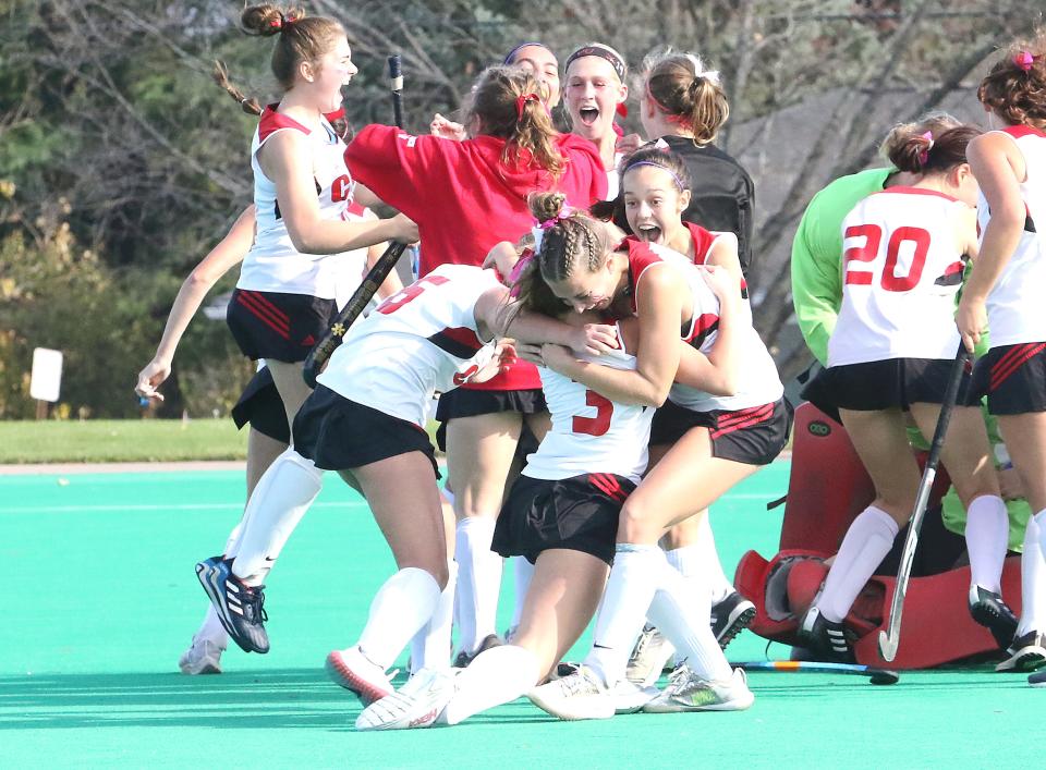 The Redhawks celebrate after their 2-1 overtime win over South Burlington in the D1 Championship game at UVM's Moulton Winder Field on November 5, 2022.