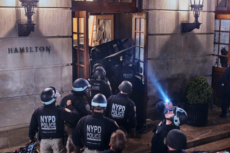 Police enter Hamilton Hall, where pro-Palestinian protestors barricaded themselves. <span class="copyright">Andres Kudacki for TIME</span>