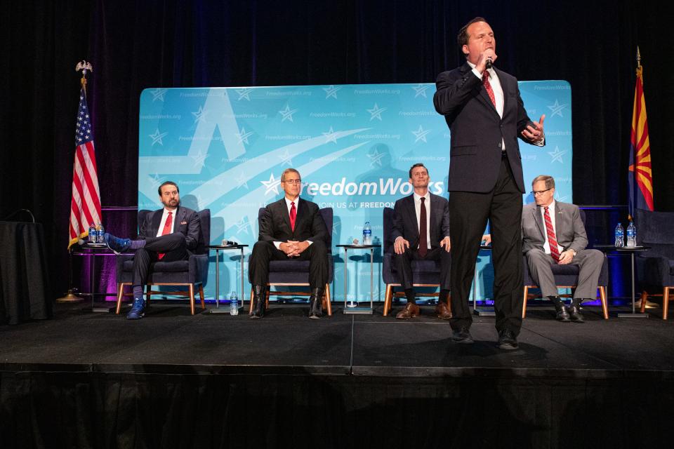 Justin Olson speaks to a crowd of Republican voters at the party's primary debate for the U.S Senate in Phoenix on June 23, 2022.