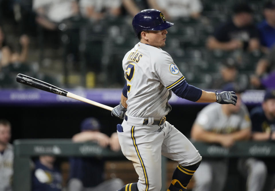 Milwaukee Brewers' Luis Urias watches his single off Colorado Rockies relief pitcher Daniel Bard during the ninth inning of a baseball game Thursday, June 17, 2021, in Denver. The Rockies won 7-3. (AP Photo/David Zalubowski)