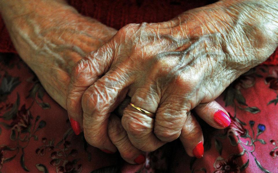  the hands of an elderly woman  - Credit: John Stillwell/PA