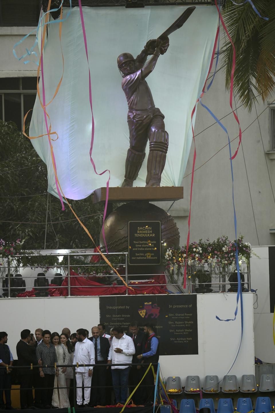 Former Indian cricket player Sachin Tendulkar, third left, front, stands during the inauguration of his statue at Wankhede stadium in Mumbai, India, Wednesday, Nov. 1, 2023. (AP Photo/Rajanish Kakade)