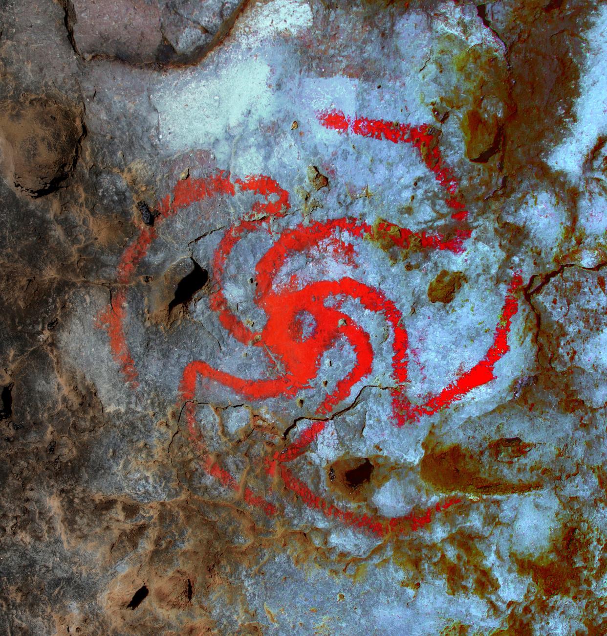 A digitally enhanced image of a pinwheel painting in Pinwheel Cave, Calif. For the first time, a study finds evidence suggesting that a hallucinogenic plant was consumed at a rock art site and that the art is likely a representation of the plant.