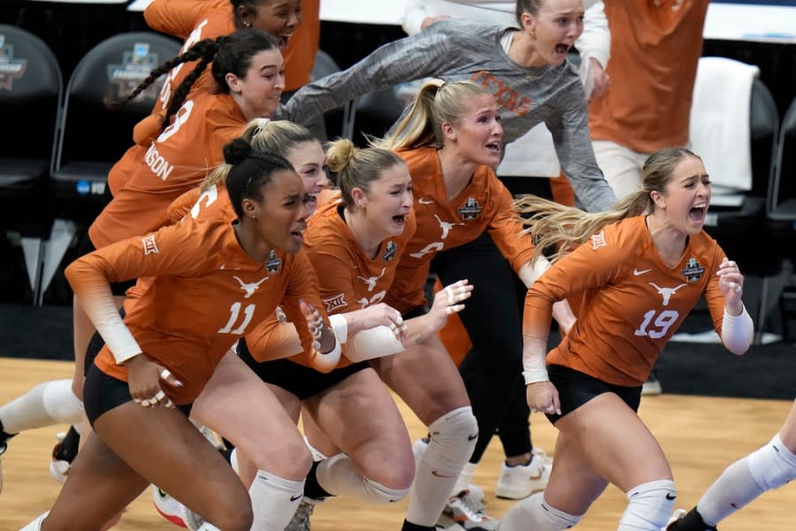 Texas players storm the court after winning the NCAA Division I women's college volleyball tournament against Nebraska Sunday, Dec. 17, 2023, in Tampa, Fla. (AP Photo/Chris O'Meara)