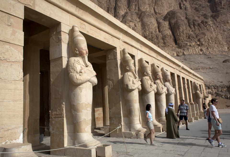 Foreign tourists visit the Hatshepsut Temple, in Luxor, Egypt, Wednesday, Feb. 27, 2013. Nineteen people were killed Tuesday in what appeared to be the deadliest hot air ballooning accident on record. The tragedy raised worries of another blow to the nation's vital tourism industry, decimated by two years of unrest since the 2011 revolution that toppled autocrat Hosni Mubarak. The southern city of Luxor has been hit hard, with vacant hotel rooms and empty cruise ships.(AP Photo/Nasser Nasser)