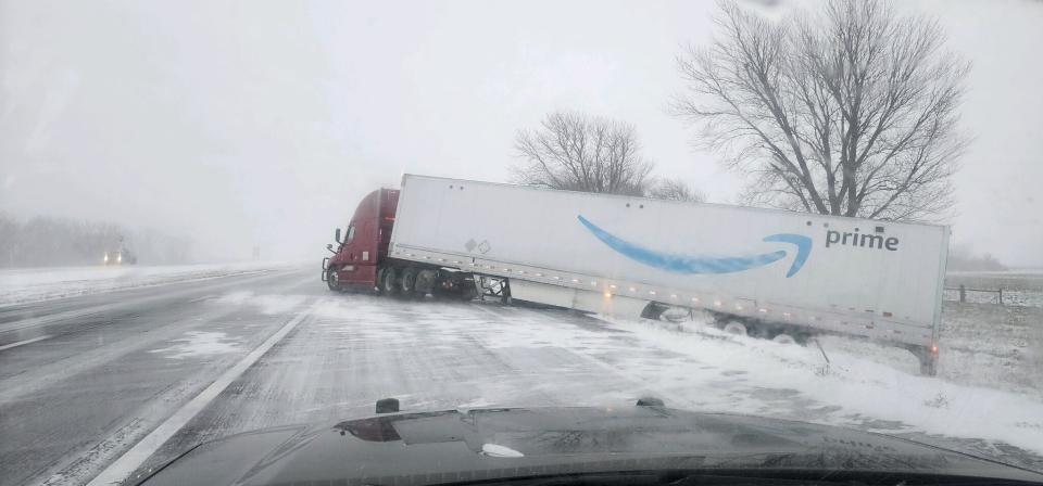 In this photo provided by Nebraska State Patrol, a tractor trailer veers into ditch on Christmas Day on Interstate 80 in Nebraska as a winter storm pummels part of the Midwest, on Monday, Dec. 25, 2023. Forecasters are predicting that heavy snow and blizzard conditions will continue through early Wednesday across part of the north-central U.S. (Nebraska State Patrol via AP)