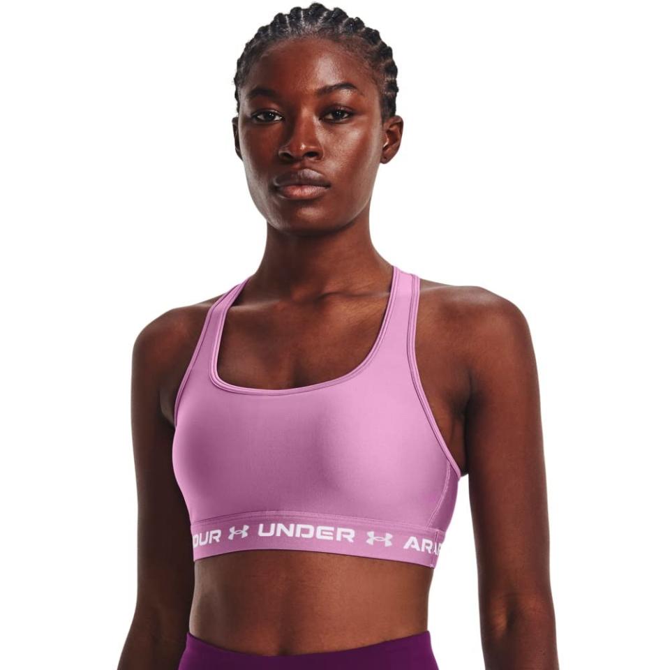 <p><a href="https://www.amazon.com/Under-Armour-Womens-Crossback-Medium/dp/B0874W4WRV/ref=sr_1_2?crid=250ZLTMSLDIRX&keywords=under%2Barmor%2Bsports%2Bbras&qid=1684190754&sprefix=under%2Barmor%2Bsports%2Bbras%2Caps%2C97&sr=8-2&th=1&psc=1&tag=syn-yahoo-20&ascsubtag=%5Bartid%7C2089.g.43992029%5Bsrc%7Cyahoo-us" rel="nofollow noopener" target="_blank" data-ylk="slk:Shop Now;elm:context_link;itc:0;sec:content-canvas" class="link ">Shop Now</a></p><p>Crossback Mid-Impact Sports Bra</p><p>$18.96</p>