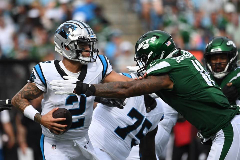 Aug 12, 2023; Charlotte, North Carolina, USA; Carolina Panthers quarterback Matt Corral (2) is sacked by New York Jets linebacker Jermaine Johnson (11) in the second quarter at Bank of America Stadium. Mandatory Credit: Bob Donnan-USA TODAY Sports