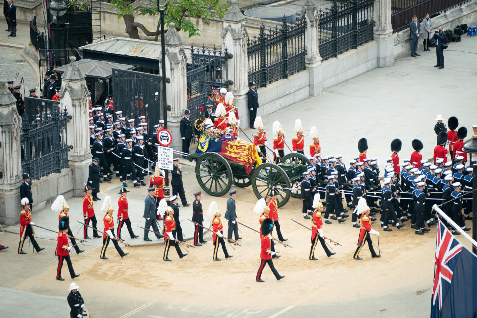 The sand on the floor along the funeral procession may also have been in place for the safety of the horses. (Reuters)