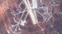 This satellite image provided by DigitalGlobe shows an image captured on April 7 of destroyed aircraft shelters on the southeast side of the Shayrat air base in Syria, following U.S. Tomahawk Land Attack Missile strikes on Friday, April 7, 2017 from the USS Ross (DDG 71) and USS Porter (DDG 78). The United States blasted the air base with a barrage of cruise missiles on Friday, April 7, 2017 in fiery retaliation for this week's gruesome chemical weapons attack against civilians. (DigitalGlobe via AP)