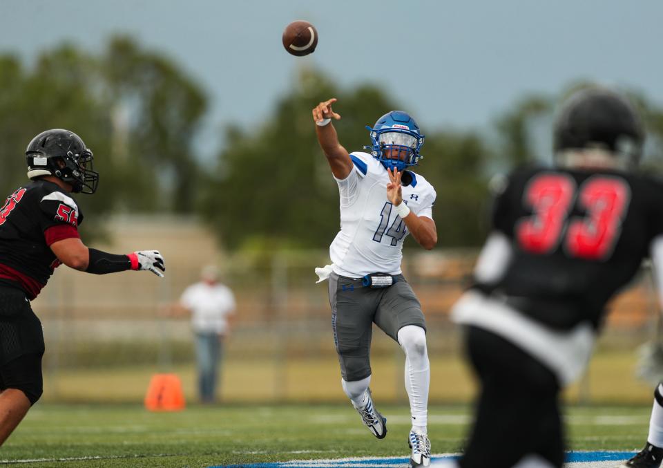 Barron Collier Cougars quarterback Niko Boyce (14) throws the ball during the first quarter of a spring football game against the Southridge Spartans at Barron Collier High School in Naples on Wednesday, May 24, 2023.