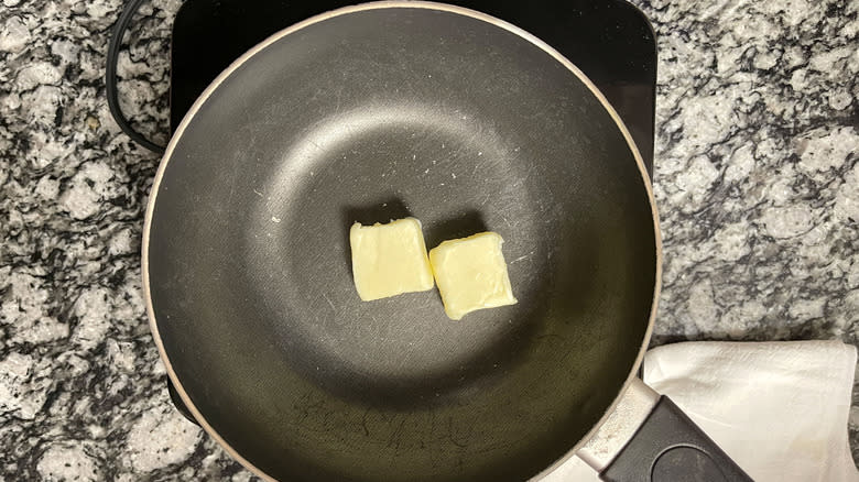 butter in frying pan 