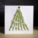 <p>Not only does this card have a yarn pattern for a Christmas tree, a silver ribbon weaves through it like tinsel. It's so wintry, you can almost smell the pine needles.</p><p><a href="https://www.danyabanya.com/yarn-laced-christmas-tree-cards-kids/" rel="nofollow noopener" target="_blank" data-ylk="slk:Get the tutorial at Danya Banya »" class="link rapid-noclick-resp"><em>Get the tutorial at Danya Banya »</em></a></p>
