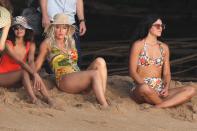 While filming a music video in Hawaii, Katy wore a tropical patterned one-piece and a straw hat.