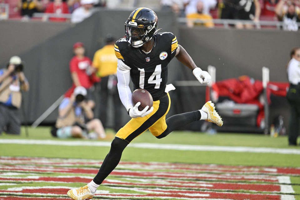 Pittsburgh Steelers wide receiver George Pickens scores a touchdown against the Tampa Bay Buccaneers during the first half of an NFL preseason football game Friday, Aug. 11, 2023, in Tampa, Fla. (AP Photo/Jason Behnken)
