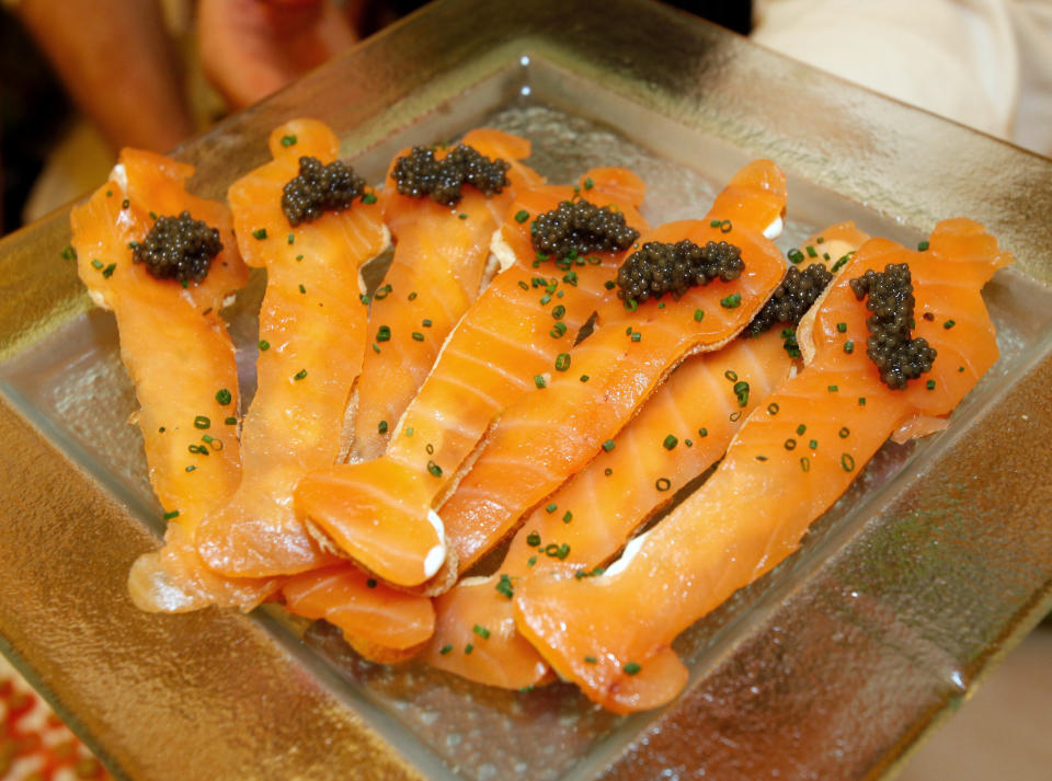Master Chef Wolfgang Puck's classic dish, smoked salmon on Oscar fatbread with Caviar is displayed for the 84th Annual Academy Awards Governors Ball at the Oscar food and beverage preview at the Kodak Theatre in Los Angeles on Thursday, Feb. 23, 2012. The Academy Awards will be held on Sunday. (AP Photo/Damian Dovarganes)