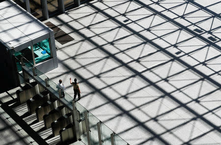 Visitors walk in the main entrance hall of new NATO headquarters during the move to the new building, in Brussels, Belgium April 19, 2018. REUTERS/Yves Herman