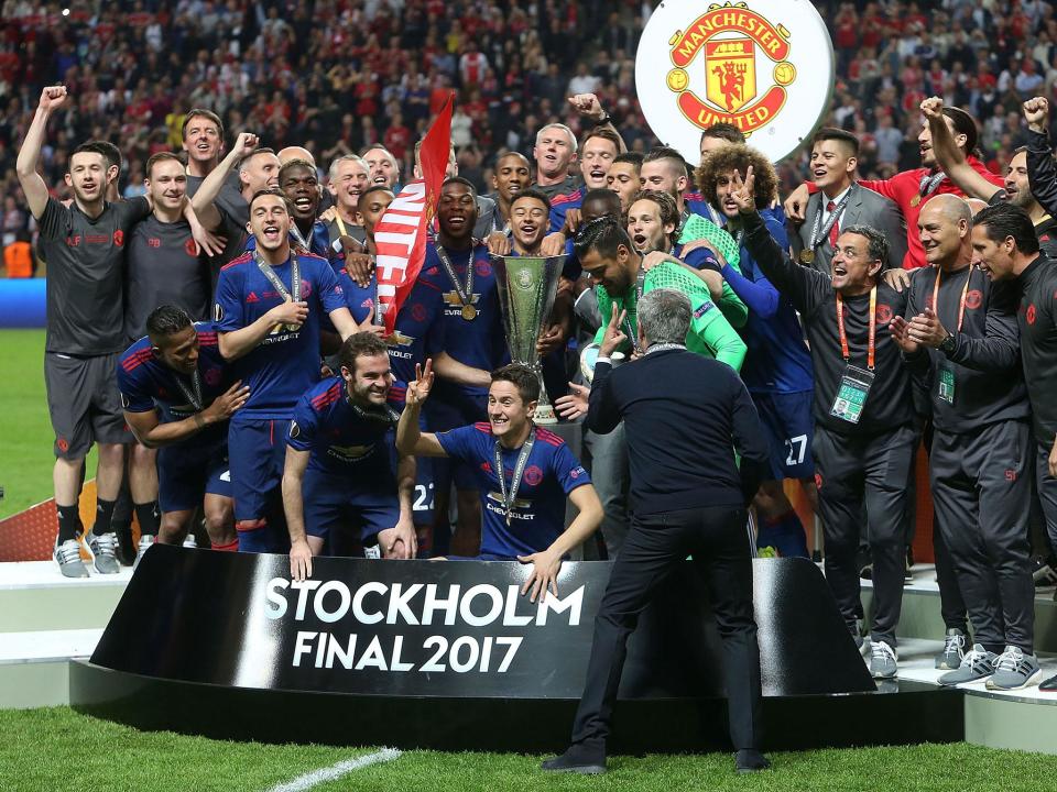 Jose Mourinho tells his Manchester United players to display three fingers after winning the 'treble': Getty