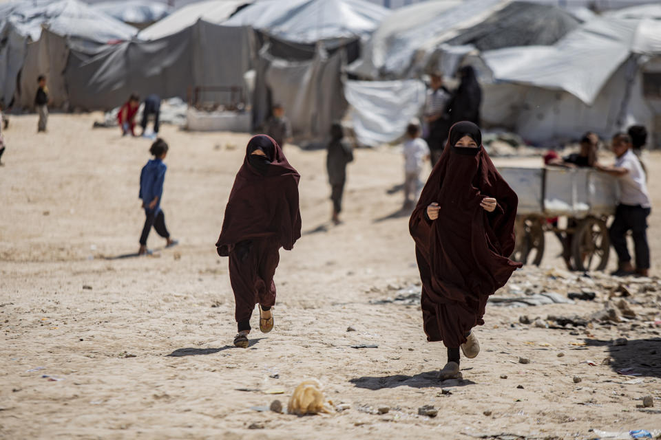 Children run in al-Hol camp, which houses families of members of the Islamic State group in Hasakeh province, Syria, Wednesday, April 19, 2023. (AP Photo/Baderkhan Ahmad)