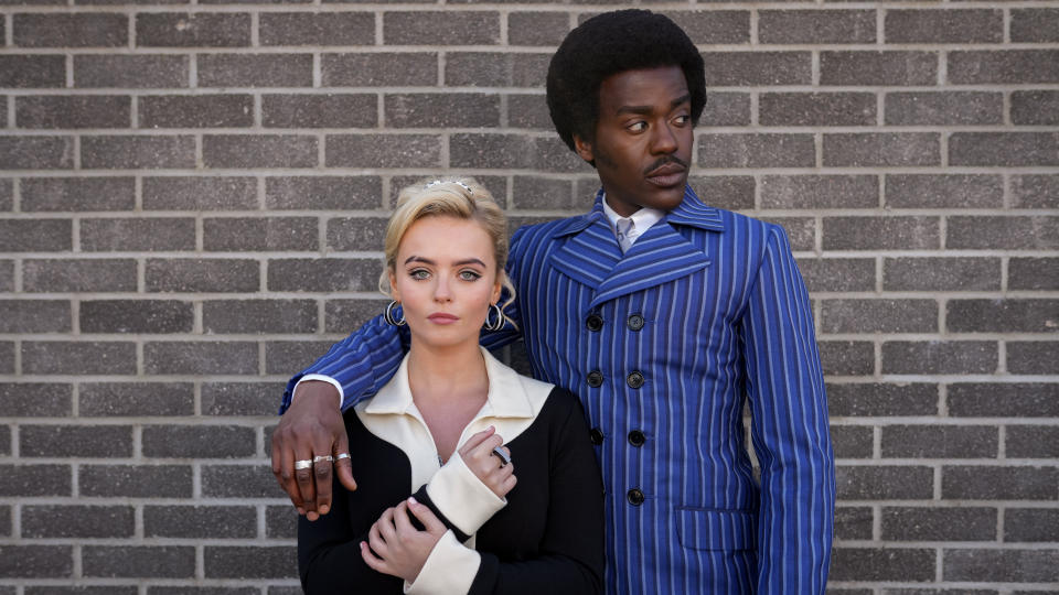 The Doctor (Ncuti Gatwa) in a blue striped suit and Ruby Sunday (Millie Gibson) in 60s-inspired attire in Doctor Who