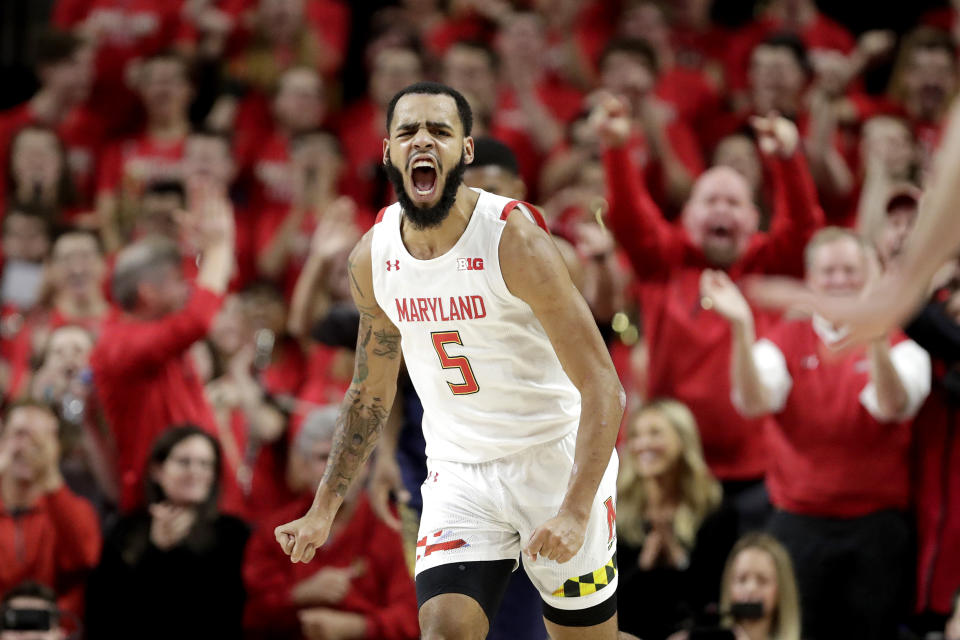 Maryland guard Eric Ayala reacts after dunking on Notre Dame during the first half of an NCAA college basketball game, Wednesday, Dec. 4, 2019, in College Park, Md. (AP Photo/Julio Cortez)