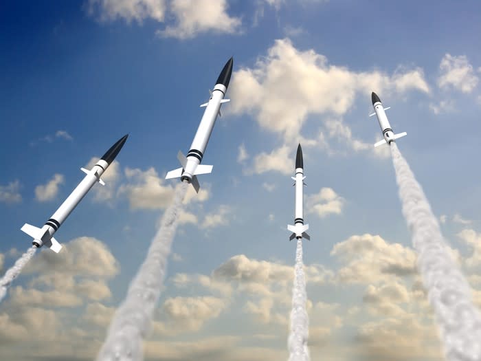 Four rockets shooting into the sky